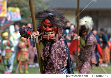Autumn Festival at Shiro Shrine - A man in demon costume holding a six-foot stick 123806357