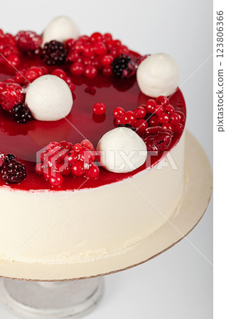 Cake decorated with fresh berries and cream Cake decorated with fresh berries and cream 123806366