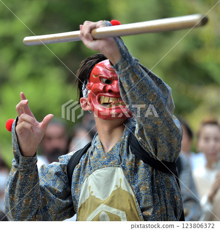 Shiro Shrine's Autumn Festival: A female stick user in demon costume holding a six-foot stick Shiro Shrine's Autumn Festival: A female stick user in demon costume holding a six-foot stick 123806372