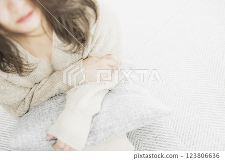 Woman in white knit Woman in white knit 123806636