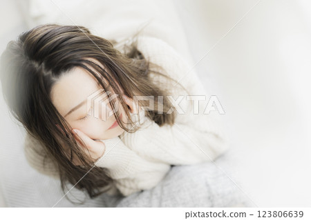 Woman in white knit Woman in white knit 123806639
