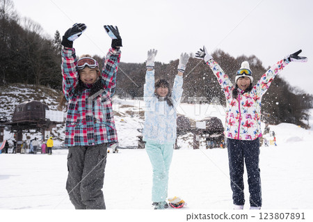 Ski slope and group of girls 123807891