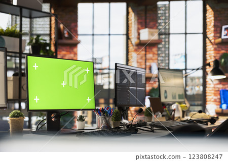 Green screen mockup PC monitors in empty call center office where unsatisfied customers call to solve technical problems. Chroma key isolated screen computer displays in customer support workspace Green screen mockup PC monitors in empty call center office where unsatisfied customers call to solve technical problems. Chroma key isolated screen computer displays in customer support workspace 123808247