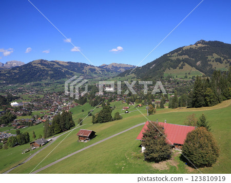 Mountain village and holiday resort Gstaad in late summer, Switzerland. Mountain village and holiday resort Gstaad in late summer, Switzerland. 123810919