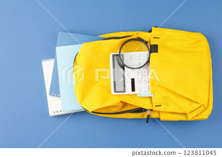 School backpack with stationery on the desk. School backpack with stationery on the desk. 123811045