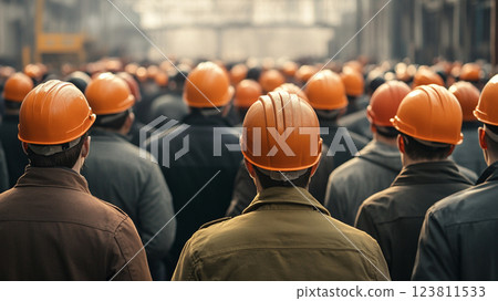 workers wearing safety helmets standing together in an assembly on the factory yard 123811533
