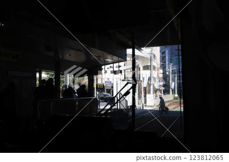 Inside a Train Cabin Overlooking Urban Railroad Tracks, Tokyo Dec 6 2024 123812065