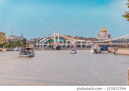 Cruise ship sails on the Moscow river in Moscow city center, popular place for walking. 123812594