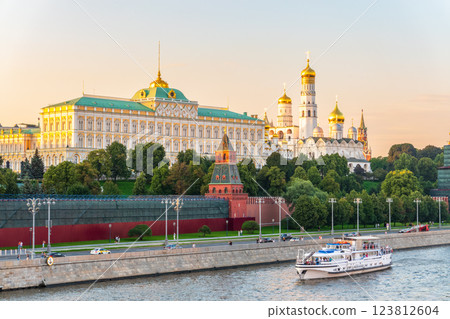 View of Kremlin with Vodovzvodnaya tower, Grand Kremlin Palace from repaired Bolshoy Kamenny Bridge in Moscow city on sunny summer day. Cruise ship sails on the Moscow river View of Kremlin with Vodovzvodnaya tower, Grand Kremlin Palace from repaired Bolshoy Kamenny Bridge in Moscow city on sunny summer day. Cruise ship sails on the Moscow river 123812604