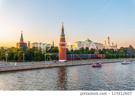 View of Kremlin with Vodovzvodnaya tower, Grand Kremlin Palace from repaired Bolshoy Kamenny Bridge in Moscow city on sunny summer day. Cruise ship sails on the Moscow river View of Kremlin with Vodovzvodnaya tower, Grand Kremlin Palace from repaired Bolshoy Kamenny Bridge in Moscow city on sunny summer day. Cruise ship sails on the Moscow river 123812607