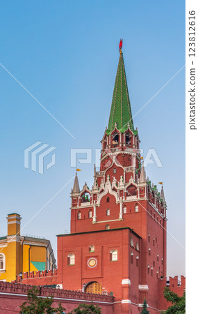 Troitskaya tower of Moscow Kremlin on a blue sky background in sunny summer day 123812616