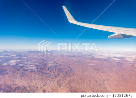Aerial view on arabian desert and Red sea mountains from airplane 123812673