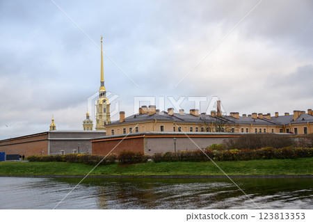 Spire and dome of Peter and Paul Cathedral and fortress wall in St. Petersburg, Russia, in autumn 123813353