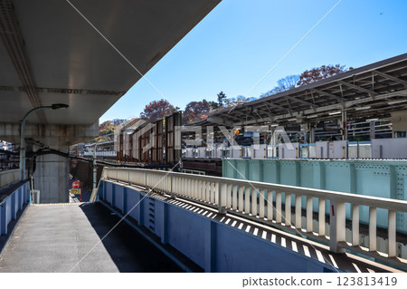 Modern Train Station Platform with Adjacent Walkway, Komagome Dec 6 2024 Modern Train Station Platform with Adjacent Walkway, Komagome Dec 6 2024 123813419