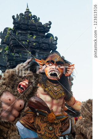 Traditional demon ogoh-ogoh at ritual parade of terrible monsters - Ngrupuk, which is held in evening of Nyepi - Balinese New Year before silence day. Arts and culture of Bali island people. 123813516