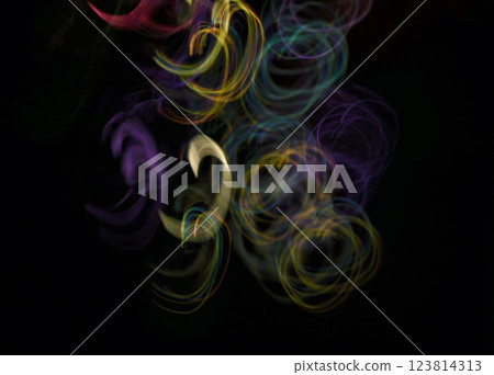 The ribbon light trail on the black background is colorful and beautiful. 123814313