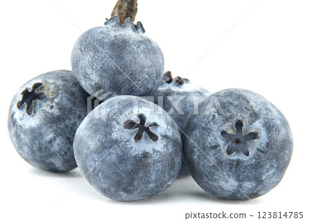 A vibrant macro shot captures the exquisite detail of a cluster of fresh blueberries. A vibrant macro shot captures the exquisite detail of a cluster of fresh blueberries. 123814785
