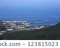 View of the town of Miyanoura in Yakushima from a high vantage point, and a high-speed ferry arriving 123815023