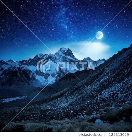 Majestic mountains under a night sky, snowy peaks illuminated by the soft glow of a full moon, vibrant starscape with the Milky Way stretching across the horizon, celestial beauty 123815039