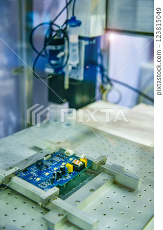 Automatic robots for assembling electronic circuit boards in factories 123815049
