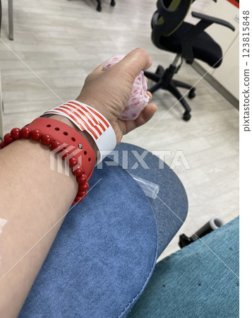 Blood Donation Process: A Woman Arm with a Needle Drawing Blood Blood Donation Process: A Woman Arm with a Needle Drawing Blood 123815848