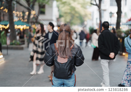 woman traveler visiting in Shanghai, China. Female Tourist with backpack sightseeing in Xintiandi. landmark and popular for tourism attractions in Shanghai. Travel and vacation concept woman traveler visiting in Shanghai, China. Female Tourist with backpack sightseeing in Xintiandi. landmark and popular for tourism attractions in Shanghai. Travel and vacation concept 123818286