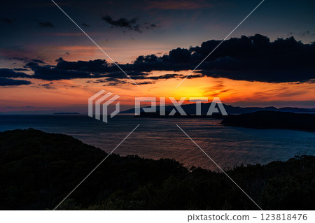 Early spring in the Kitan Straits: Sunset over Awaji Island and a beautiful sunset sky② Early spring in the Kitan Straits: Sunset over Awaji Island and a beautiful sunset sky② 123818476