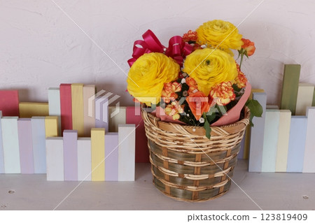 Yellow ranunculus arrangement 123819409