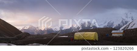 Wide panorama of expedition campsite in high mountains during sunset, Pamir Mountains, Kyrgyzstan Wide panorama of expedition campsite in high mountains during sunset, Pamir Mountains, Kyrgyzstan 123820266
