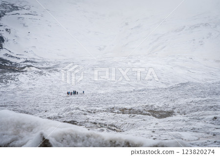 Group of people relaxing on the huge glacier field, Pamir Mountains, Kyrgyzstan 123820274