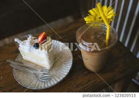happy and cheerful with coffee and cake on wooden table in coffee shop 123820513