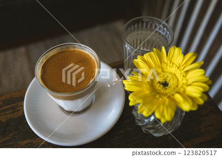 happy and cheerful with coffee and cake on wooden table in coffee shop happy and cheerful with coffee and cake on wooden table in coffee shop 123820517