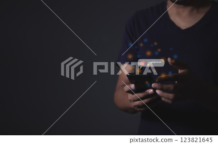 Young man hand holding smartphone to review and gives 1 star Young man hand holding smartphone to review and gives 1 star 123821645