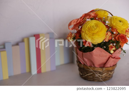 Yellow ranunculus arrangement 123822095