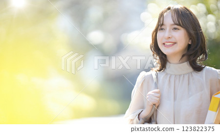 Female college student walking on campus Female college student walking on campus 123822375