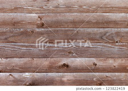 Rustic wooden planks arranged horizontally showcasing natural grains Rustic wooden planks arranged horizontally showcasing natural grains 123822419