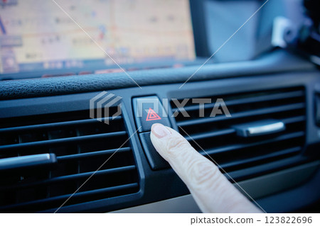 Middle-aged woman in a suit driving a car 123822696