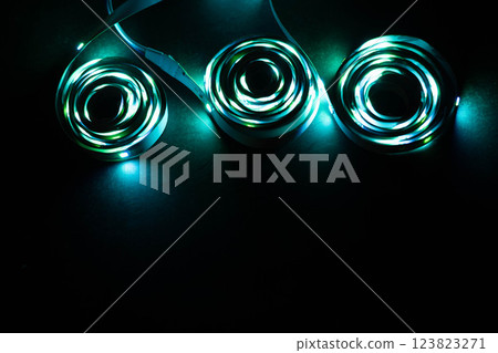 Glowing LED Strips in Spiral Formation on Table 123823271
