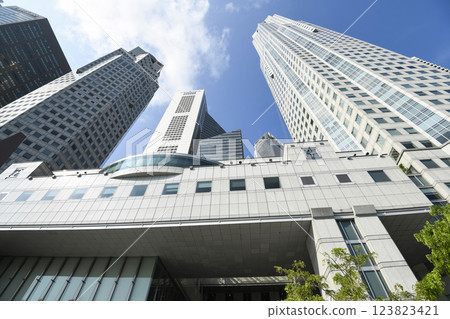 Low-angle view of the United Overseas Bank(UOB) headquartered at Raffles Place, Singapore, It is one of the three "big local banks" in Singapore. Low-angle view of the United Overseas Bank(UOB) headquartered at Raffles Place, Singapore, It is one of the three "big local banks" in Singapore. 123823421
