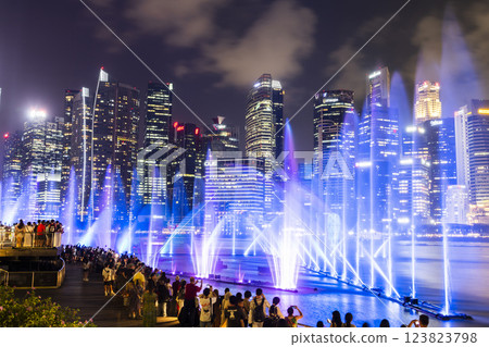 Beautiful view of the nightly music, water, and light show at Marina Bay Sands, here is an integrated resort fronting Marina Bay in Singapore. 123823798