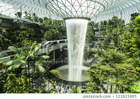 View of HSBC Rain Vortex at Jewel Changi Airport, Singapore, is the world's largest and tallest indoor artificial waterfall and surrounded by a terraced forest setting. 123823805