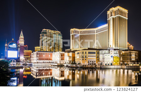 Beautiful night view of Venetian Gothic-style buildings in Cotai, Macau with beautiful reflections of the majestic buildings in the water, owned by the American Las Vegas Sands company. 123824127