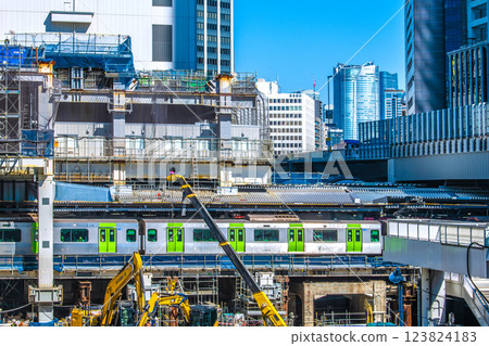Tokyo cityscape in Japan: Goodbye, Shibuya Station West Exit. Heavy machinery is now gathering at the site of the building on the right... Roppongi, etc. are in the far right. 123824183