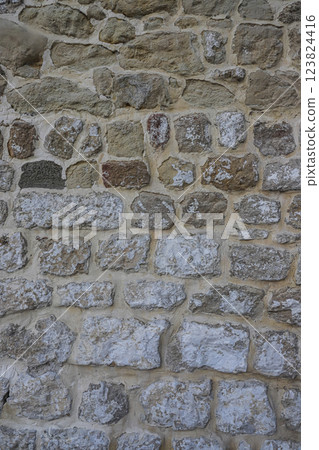 Exploring the rustic stone wall texture in Albania showcasing unique patterns and natural colors Exploring the rustic stone wall texture in Albania showcasing unique patterns and natural colors 123824416