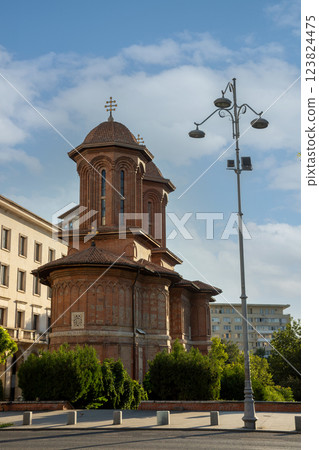 Historic church in Bucharest, Romania showcasing beautiful architecture under a clear blue sky 123824475