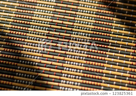 Closeup view of a beautiful bamboo mat with a distinct pattern 123825361