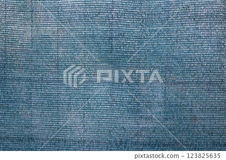 Close up of a blue carpet with numerous small squares Close up of a blue carpet with numerous small squares 123825635