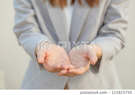 Image of hands receiving something (stock photo) 123825750