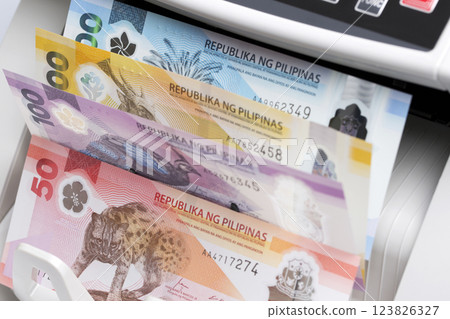 Philippine peso in the counting machine 123826327