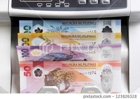 Philippine peso in the counting machine 123826328